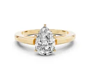 Pear Cut Diamond Solitaire Ring Set in Yellow gold with Prong Setting and Classic Band
