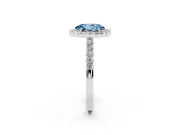 Fancy Blue Oval Cut Diamond Halo Pavé Solitaire Ring Set in Platinum with Prong-Set Center Stone
