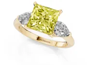 Fancy Yellow Three-Stone Princess Cut Diamond Ring Set in Yellow gold with Pear Side Stones and Prong Setting