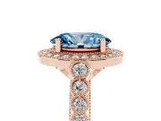 Fancy Blue Oval Cut Diamond Milgrain Halo Solitaire Ring Set in Rose gold with Bezel Set Side Stones and Pavé Band