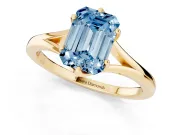 Fancy Blue Emerald Cut Diamond Solitaire Ring Set in Yellow gold with Polished Tapered Band and Prong Setting