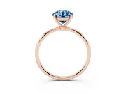 Fancy Blue Round Cut Diamond Solitaire Engagement Ring Set in Rose gold with Thin Band and Prong Setting