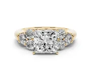 Princess Cut Diamond Cluster Ring Set in Yellow gold with Round Accent Stones and Prong Setting on a Plain Band