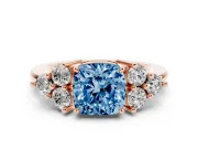 Fancy Blue Cushion Cut Diamond Solitaire Ring Set in Rose gold with Cluster Accents on Each Side