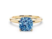 Fancy Blue Cushion Cut Diamond Solitaire Engagement Ring Set in Yellow gold with Prong Setting and Polished Band