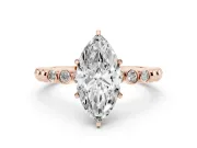 Marquise Cut Diamond Solitaire Engagement Ring Set in Rose gold with Bezel Accents on Beaded Band