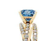 Fancy Blue Princess Cut Diamond Solitaire Twist Band Ring Set in Yellow gold with Pavé Setting and Prong Head