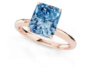 Fancy Blue Radiant Cut Diamond Solitaire Engagement Ring Set in Rose gold with Prong Setting and Polished Band