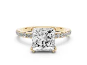 Princess Cut Diamond Brilliant Solitaire Set in Yellow gold with Pavé Band and Claw Prong Setting