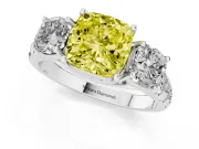 Fancy Yellow Cushion Cut Diamond Three-Stone Ring Set in White gold with Pavé Band
