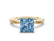 Fancy Blue Princess Cut Diamond Solitaire Ring Set in Yellow gold with Twisted Band and Bead Prong Setting