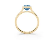 Fancy Blue Bezel Set Radiant Cut Diamond Solitaire Ring Set in Yellow gold with Tapered Band