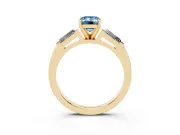 Fancy Blue Emerald Cut Diamond Solitaire Ring Set in Yellow gold with Tapered Baguette Side Stones and Prong Setting