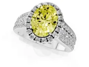 Fancy Yellow Oval Cut Diamond Halo Ring Set in White gold with Pavé Band and Raised Center Setting