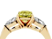 Fancy Yellow Three-Stone Emerald Cut Diamond Ring Set in Yellow gold with Pear Side Stones and Prong Setting
