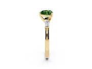 Fancy Green Heart Cut Diamond Solitaire Ring Set in Yellow gold with Tapered Baguette Side Stones and Prong Setting