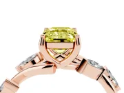 Fancy Yellow Emerald Cut Diamond Solitaire Ring Set in Rose gold with Twisted Marquise Accent Band