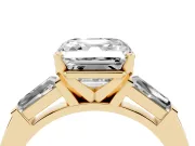 Asscher Cut Diamond Solitaire Ring Set in Yellow gold with Tapered Baguette Side Stones and Prong Setting