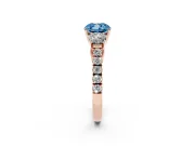 Fancy Blue Cushion Cut Diamond Three-Stone Ring Set in Rose gold with Round Side Stones and Delicate Pavé Band