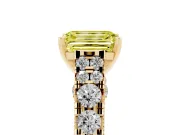 Fancy Yellow Emerald Cut Diamond Classic Solitaire Ring Set in Yellow gold with Pavé Band and Prong Setting