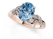 Fancy Blue Oval Cut Diamond Solitaire Ring Set in Rose gold with Marquise Twist Band and Prong Setting