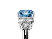 Fancy Blue Princess Cut Diamond Cluster Ring Set in Silver with Round Accent Stones and Prong Setting on a Plain Band