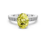 Fancy Yellow Oval Cut Diamond Solitaire Ring Set in Platinum with Slim Pavé Band and Prong Setting