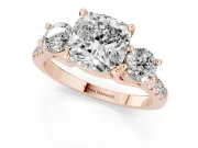 Three-Stone Cushion Cut Diamond Pavé Band Ring Set in Rose gold with Prong-Set Trio