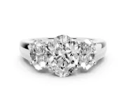 Three-Stone Oval Cut Diamond Ring Set in Silver with Matching Prong Settings and Plain Band