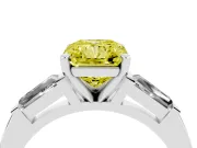 Fancy Yellow Radiant Cut Diamond Solitaire Ring Set in White gold with Tapered Baguette Side Stones and Prong Setting