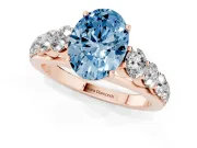 Oval Graduated Side Stone Engagement Ring Setting for a Fancy Blue Lab-Grown Diamond | Flat Top Band | Rose Gold
