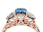 Fancy Blue Emerald Cut Diamond Three-Stone Ring Set in Rose gold with Braided Band
