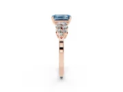 Fancy Blue Emerald Cut Diamond Cluster Engagement Ring Set in Rose gold with Pavé Band and Prong Setting