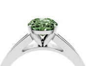 Fancy Green Oval Cut Diamond Solitaire Ring Set in White gold with Channel-Set Band and Prong Setting