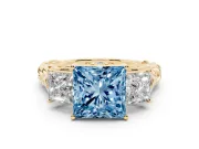 Fancy Blue Princess Cut Diamond Three-Stone Ring Set in Yellow gold with Braided Band