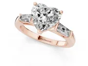 Heart Cut Diamond Solitaire Ring Set in Rose gold with Tapered Baguette Side Stones and Prong Setting
