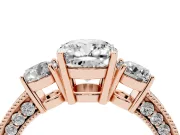 Cushion Cut Diamond Three-Stone Ring Set in Rose gold with Round Side Stones and Pavé Band