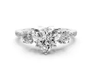 Heart Cut Diamond Three-Stone Ring Set in White gold with Pavé Band and Graduated Sides