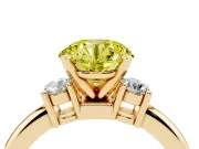 Fancy Yellow Three-Stone Round Cut Diamond Ring Set in Yellow gold with Prong Setting and Plain Band