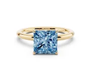 Fancy Blue Princess Cut Diamond Solitaire Ring Set in Yellow gold with Thin Band and Prong Setting