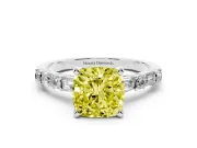 Fancy Yellow Cushion Cut Diamond Solitaire Set in Platinum with Side Baguettes and Channel Set Band