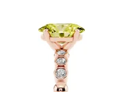 Fancy Yellow Oval Cut Diamond Solitaire Engagement Ring Set in Rose gold with Bezel Accents on Beaded Band