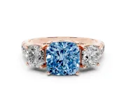 Fancy Blue Cushion Cut Diamond Three-Stone Ring Set in Rose gold with Pavé Band