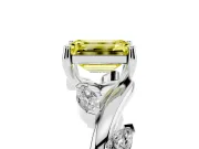 Fancy Yellow Emerald Cut Diamond Solitaire Ring Set in Platinum with Twisted Marquise Accent Band
