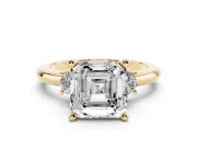 Three-Stone Asscher Cut Diamond Ring Set in Yellow gold with Prong Setting and Plain Band