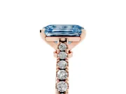 Fancy Blue Emerald Cut Diamond Solitaire Engagement Ring Set in Rose gold with Delicate Pavé Band and Prong Setting