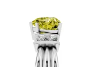 Fancy Yellow Three-Stone Heart Cut Diamond Channel Set Ring Set in Platinum with Bar Prongs
