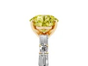Fancy Yellow Round Cut Diamond Solitaire Set in Yellow gold with Side Baguettes and Channel Set Band