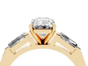Emerald Cut Diamond Solitaire Ring Set in Yellow gold with Tapered Baguette Side Stones and Prong Setting
