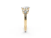 Oval Cut Diamond Cluster Ring Set in Yellow gold with Round Accent Stones and Prong Setting on a Plain Band
